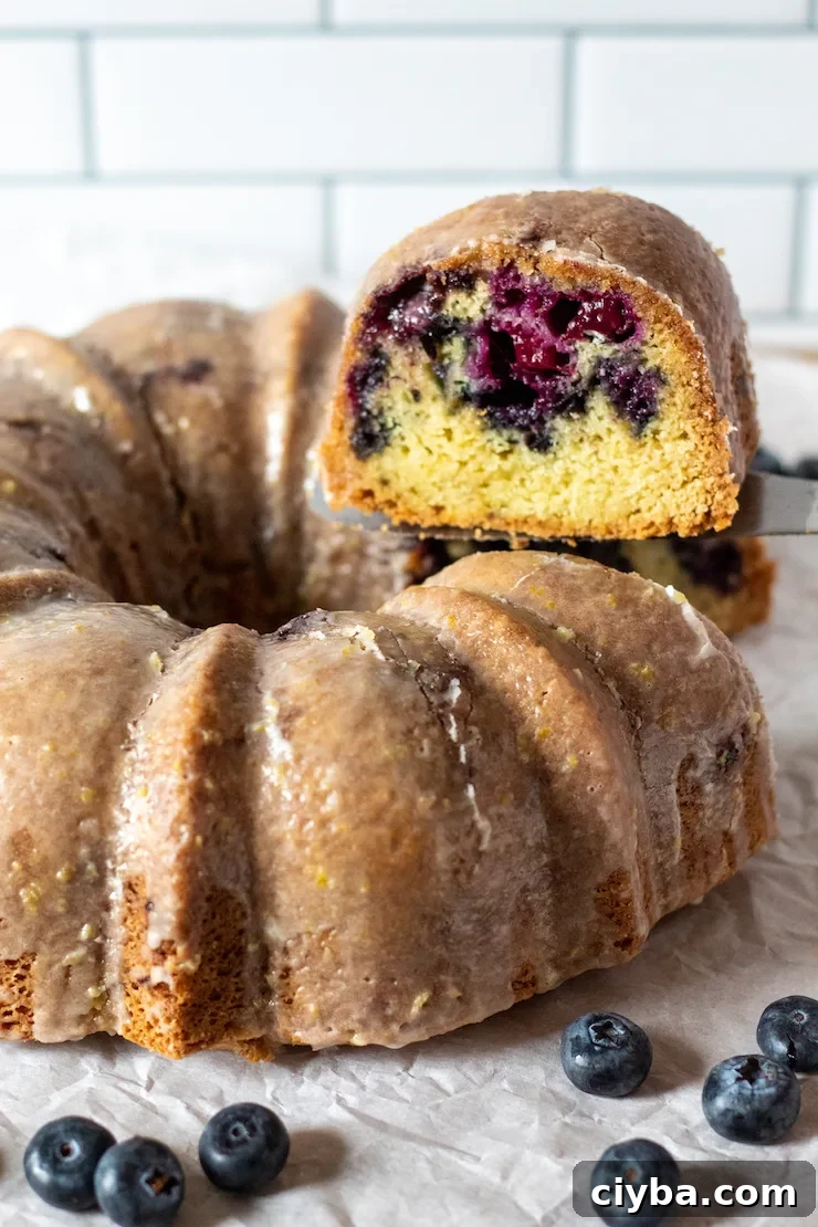 Serving slice coming out of Bundt cake.