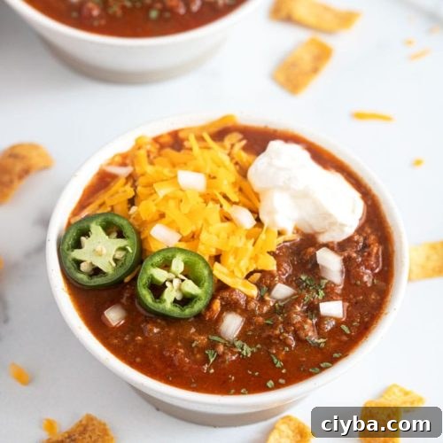 Instant Pot Texas Chili Recipe — Ready in 30 Minutes 16 A bowl of chili with assorted toppings.