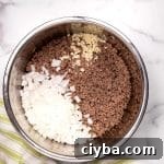 Instant Pot Texas Chili Recipe — Ready in 30 Minutes 19 cooked ground beef with chopped onions and minced garlic in an instant pot
