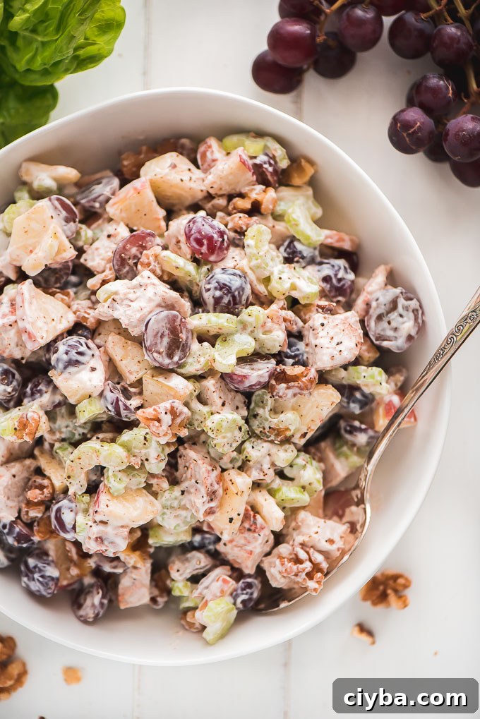 Chicken Waldorf Salad all mixed together in a bowl ready to serve.