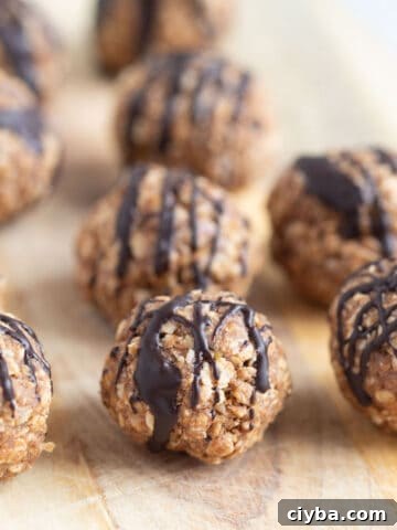 Vanilla protein balls on wooden board.