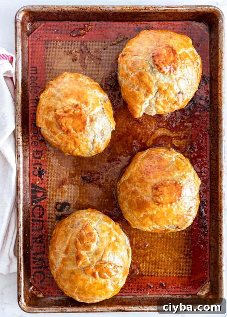 overhead shot of Individual Beef Wellingtons on baking tray
