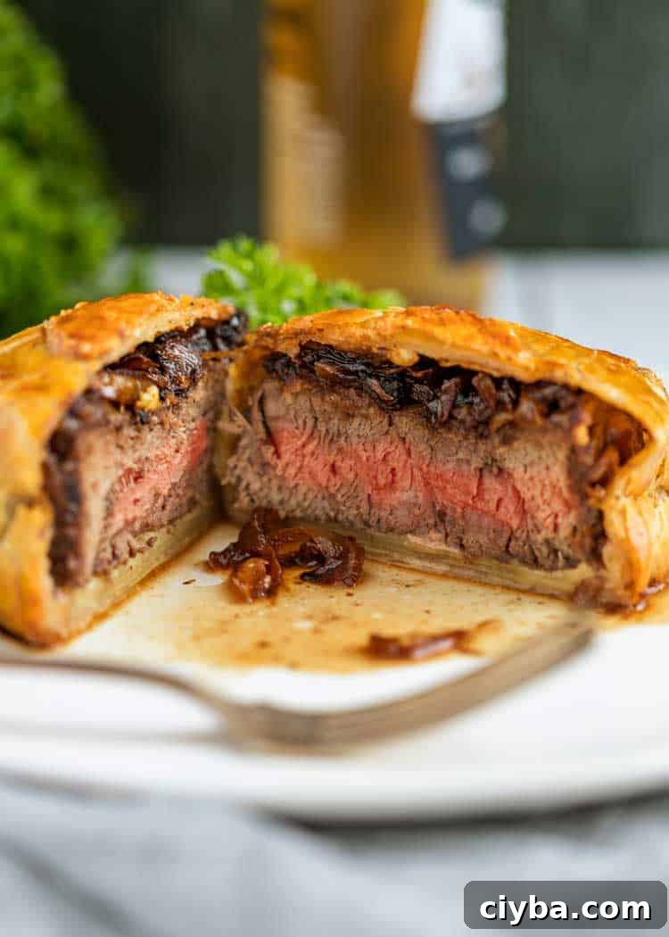 sliced Individual Beef Wellingtons on plate