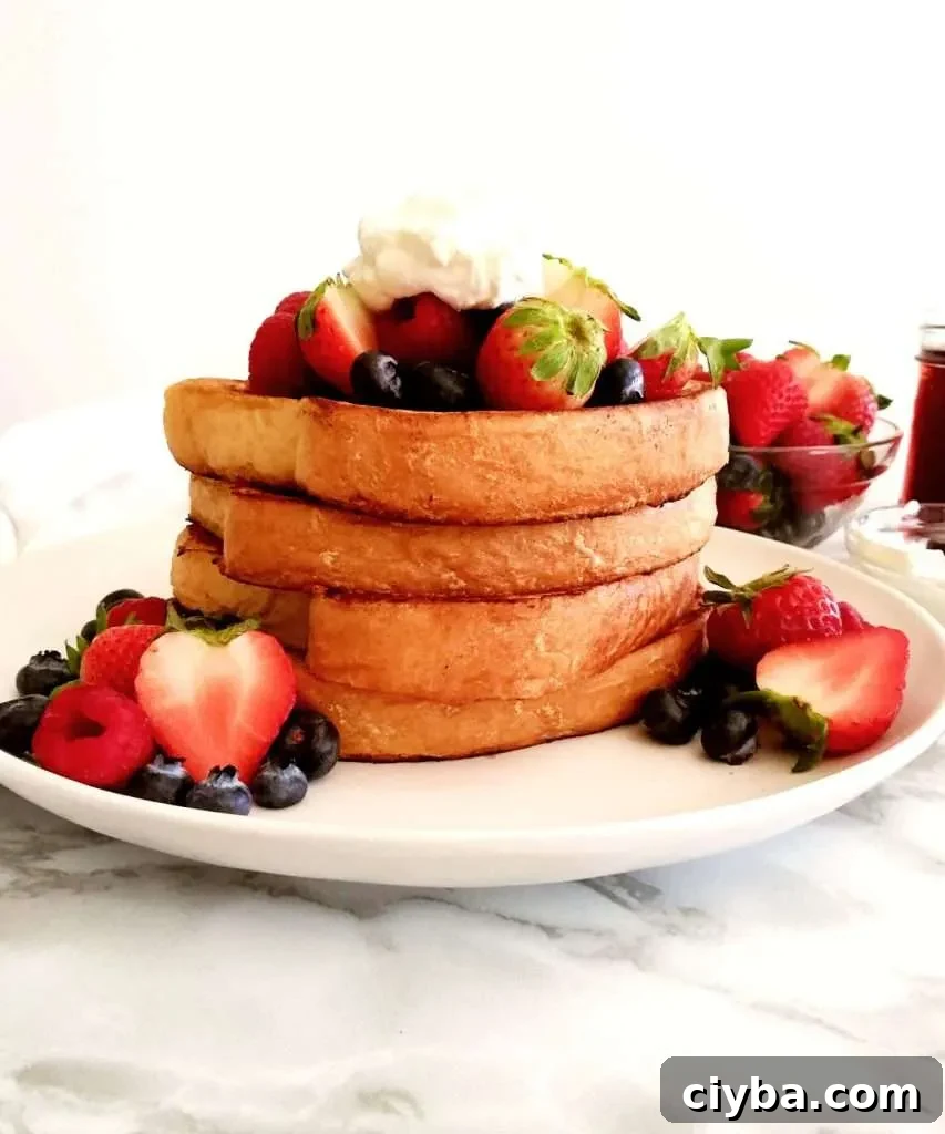 French toast topped with fruits and whipped cream