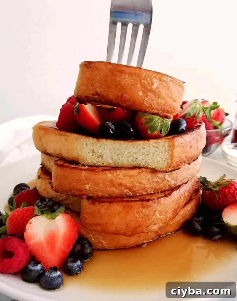 French toast lifting piece off with fork