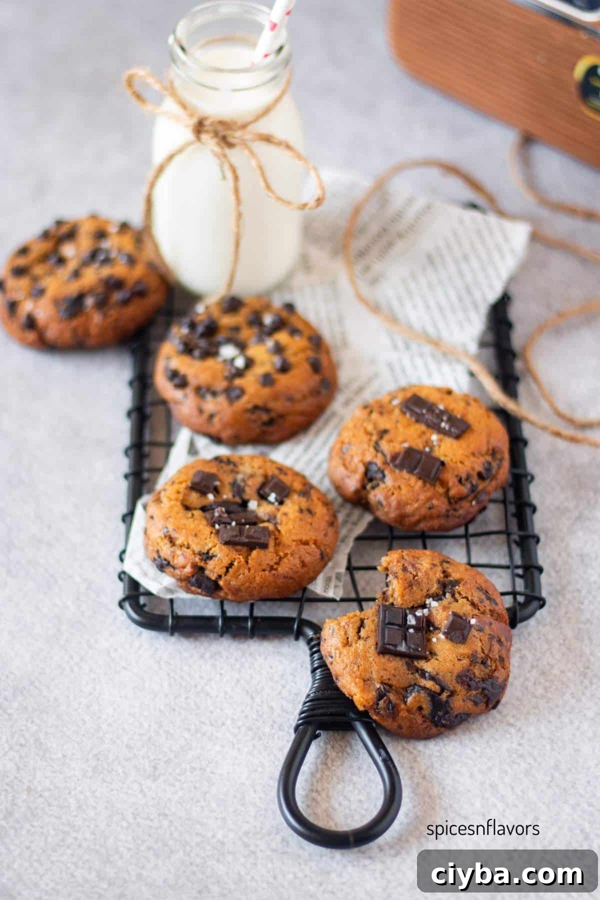 5 brown butter sourdough chocolate chip cookies placed on wire rack