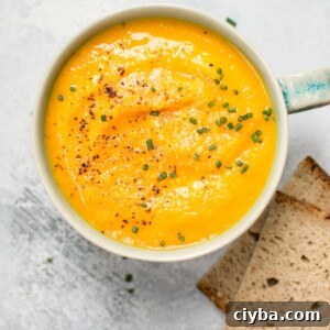 This vegetarian acorn squash and carrot soup is healthy, fresh, flavorful, and takes the chill off.
