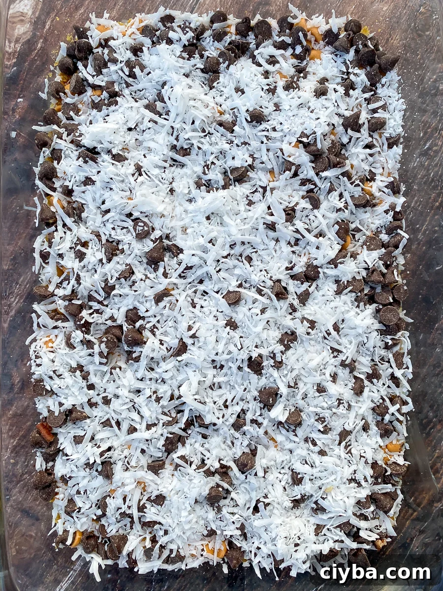 Layer of bright white coconut on magic bars