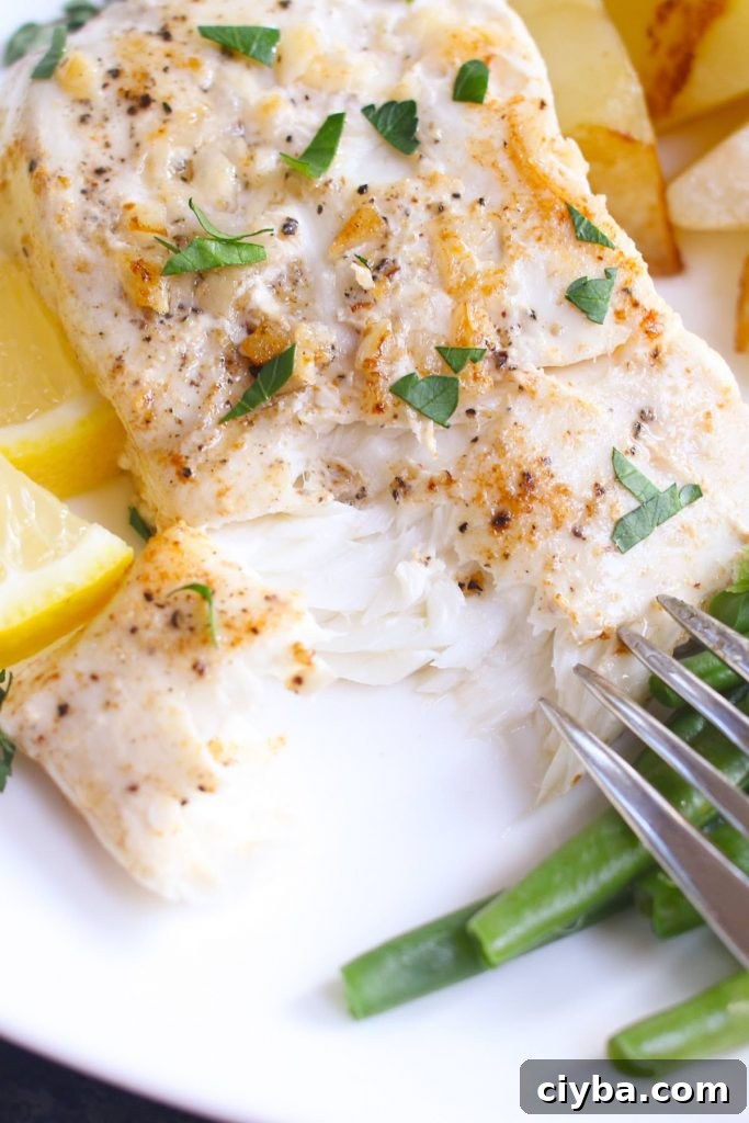Close-up showing the tender and flaky texture of the cooked sous vide halibut.