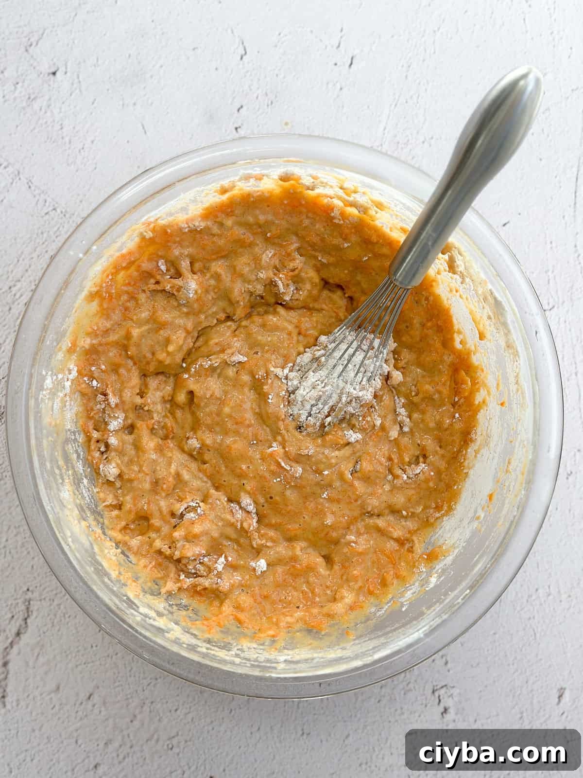 mixing in the dry ingredients with a whisk.