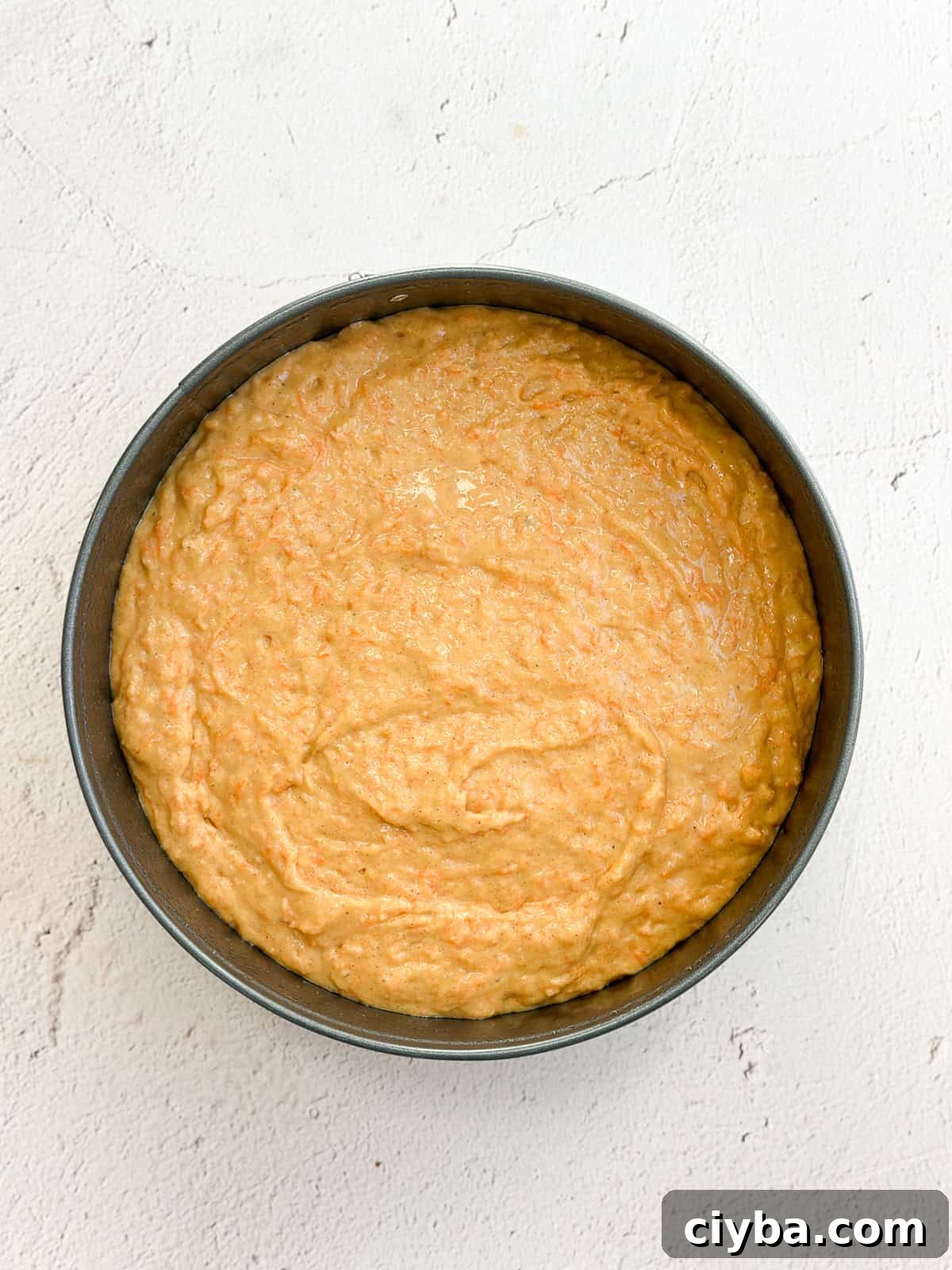 Carrot cake batter in the baking pan.