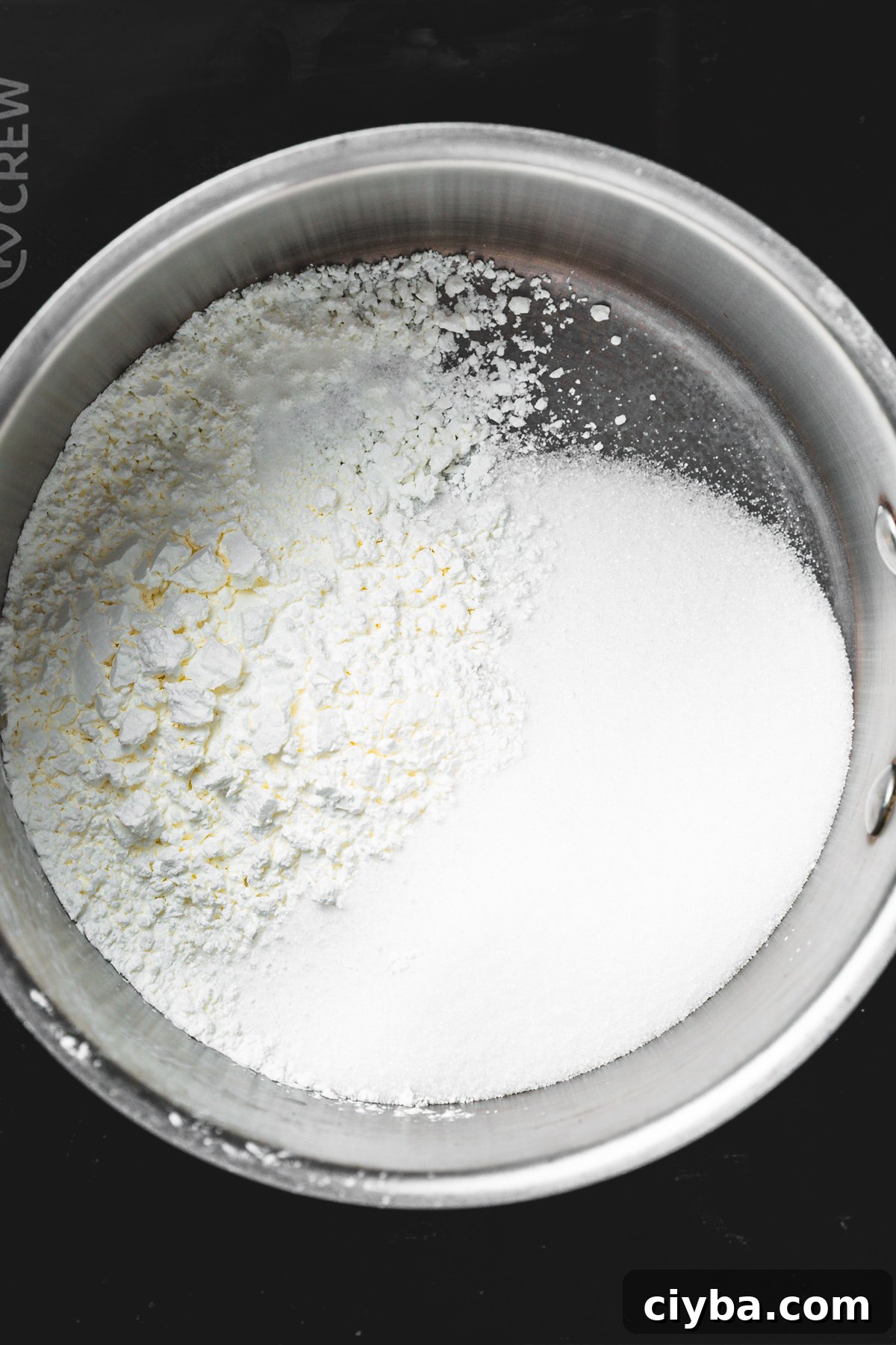 saucepan with sugar and cornstarch mixture for lemon filling