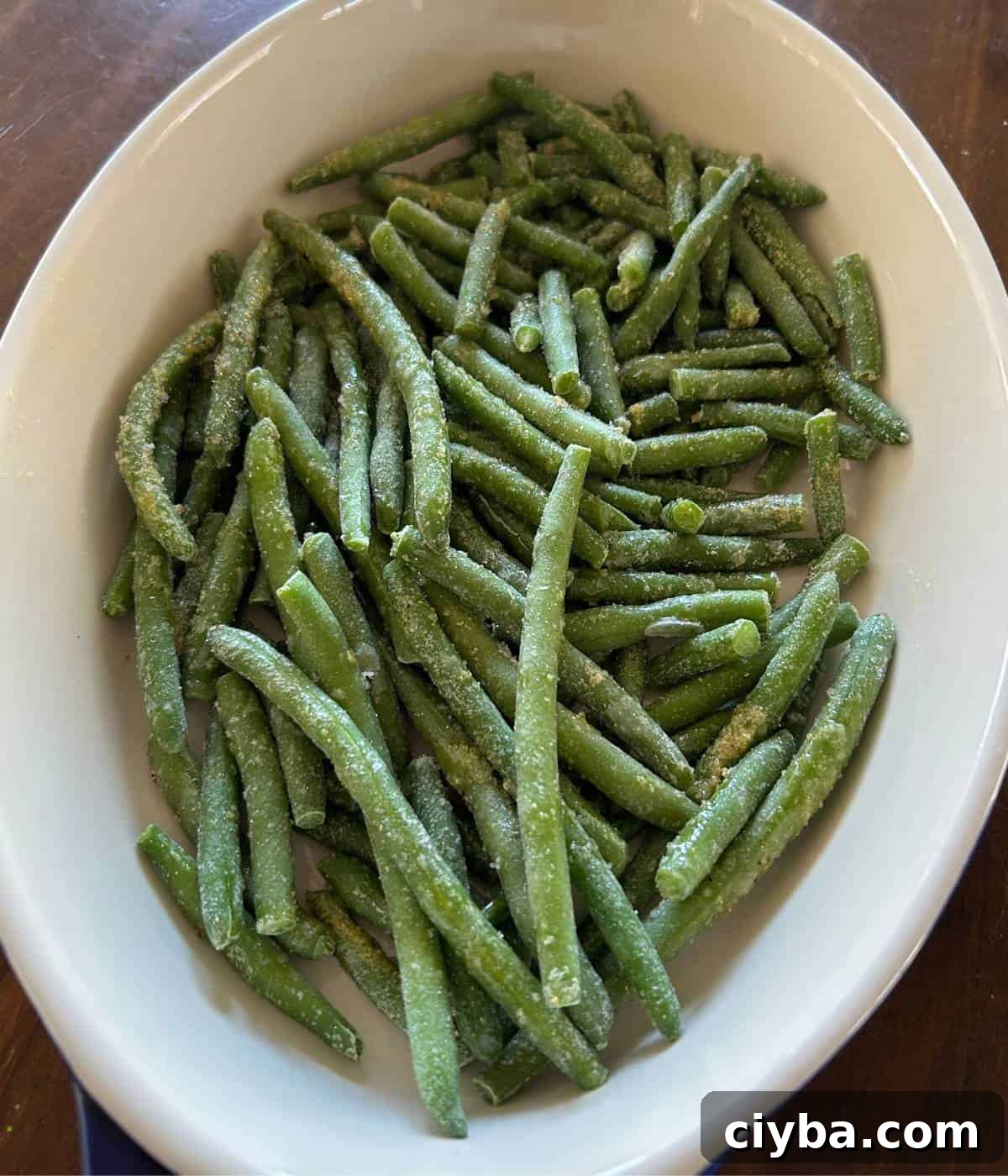 Frozen green beans in casserole dish.