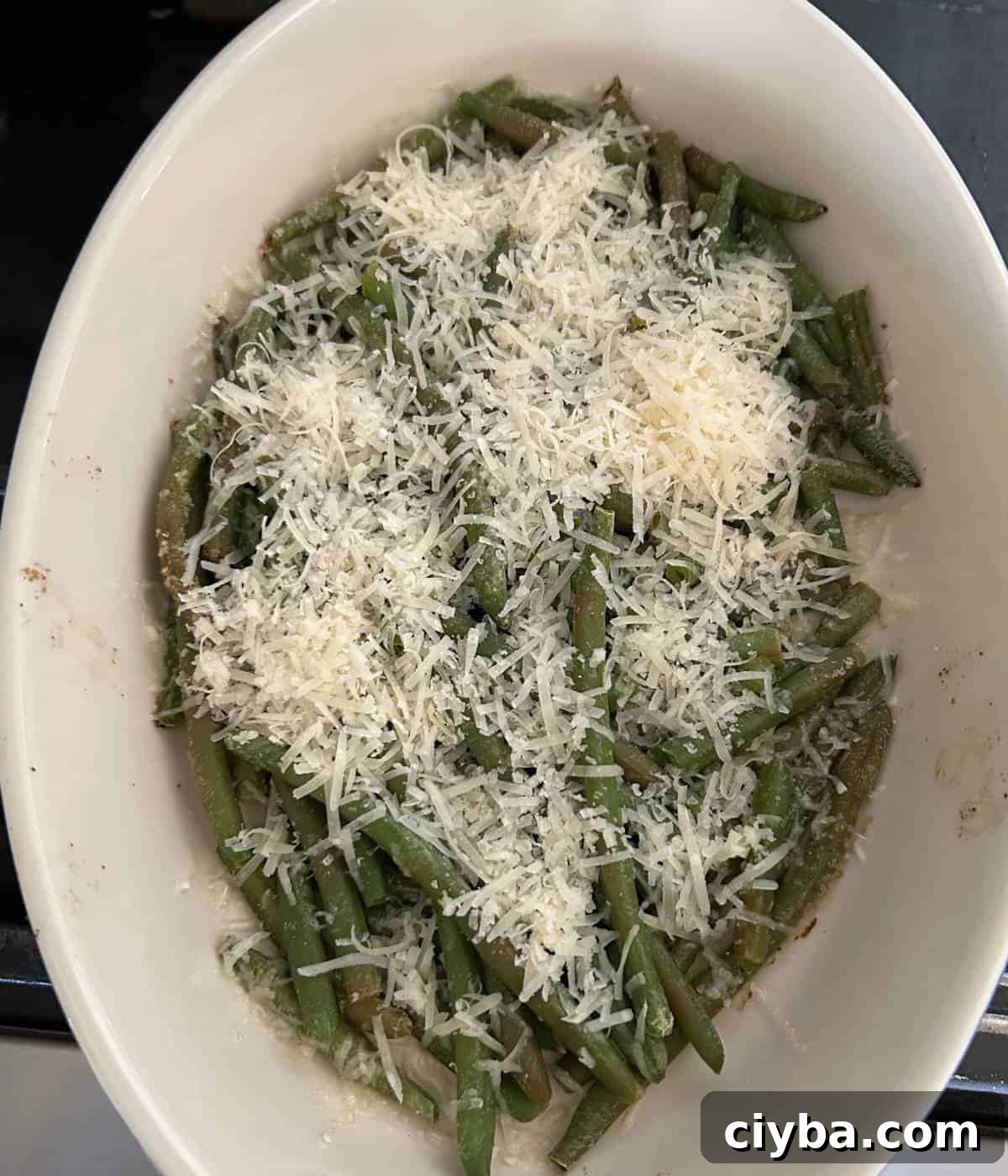 Roasted frozen green beans topped with garlic and cheese.