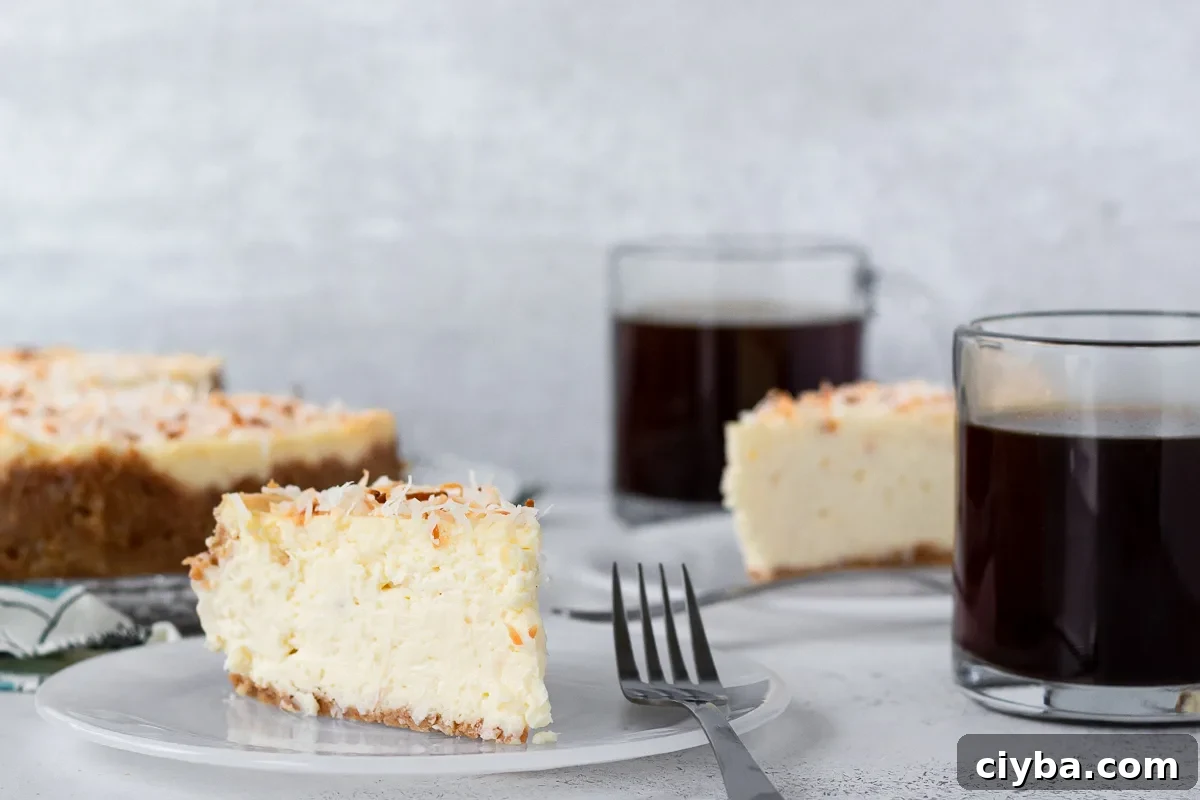 Toasted Coconut Cheesecake Recipe with Crunchy Coconut Crust 4 slice of coconut cheesecake on a plate to show the texture