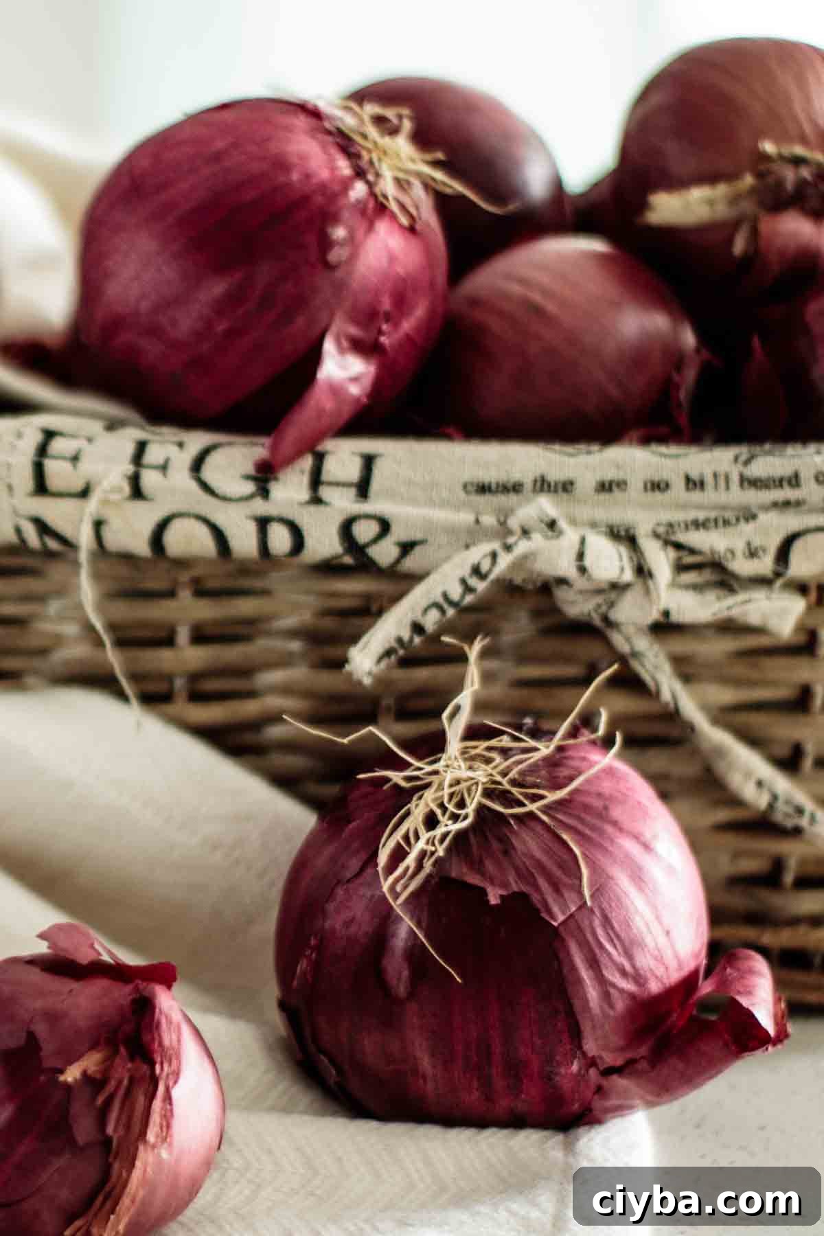 Red onions in a basket.
