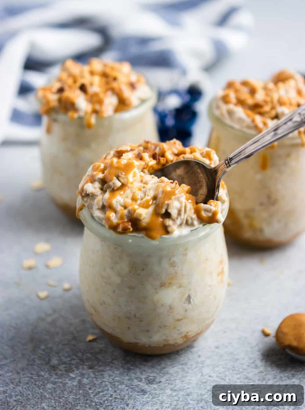 Overnight oatmeal in jar with spoon.