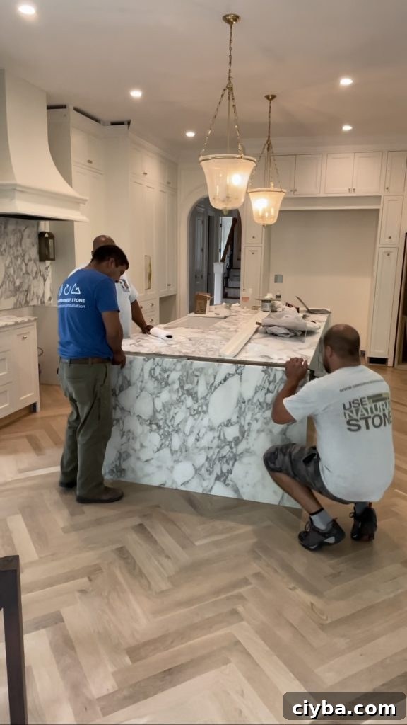 a waterfall kitchen island being installed