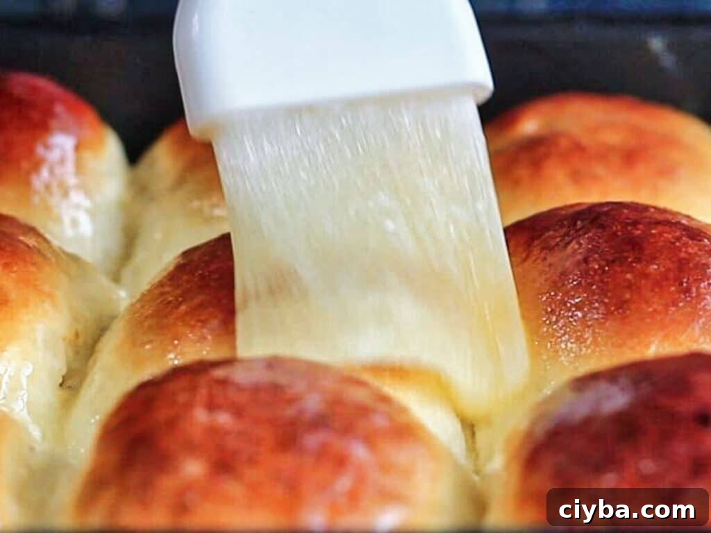 brushing baked rolls with melted butter.