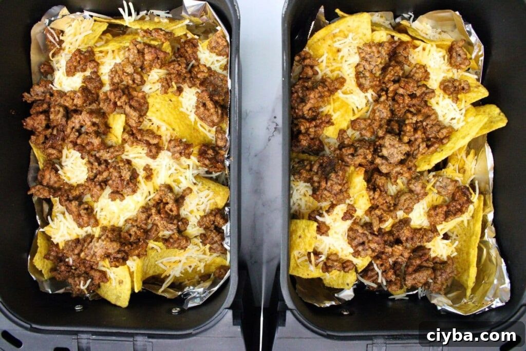 top with another layer of chips, ground beef, and cheese