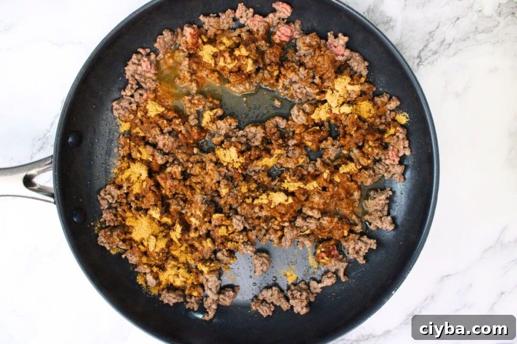 add taco seasoning to the ground beef