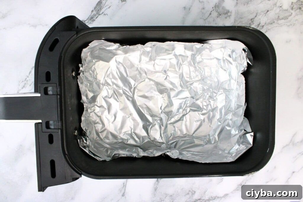 line air fryer basket with foil to create a bowl