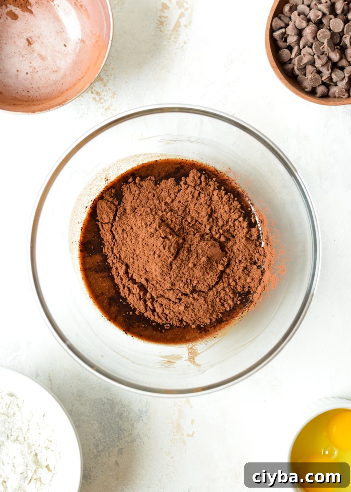 melted chocolate and butter with cocoa powder on top