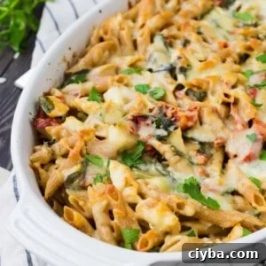 Baked pasta in white oval casserole dish.