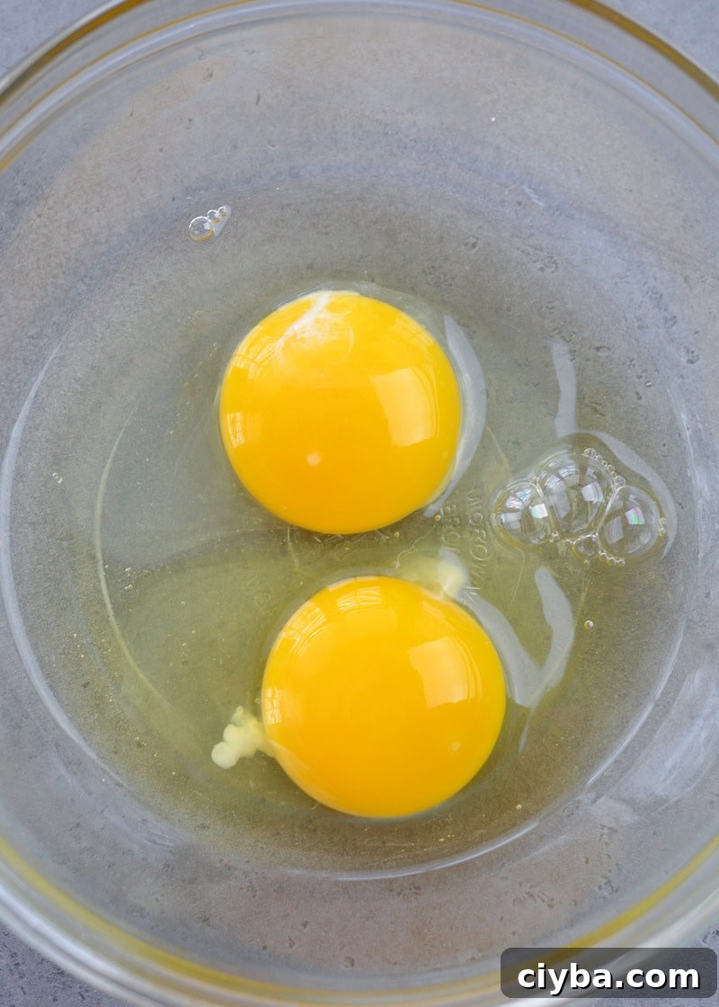 two eggs in a glass bowl