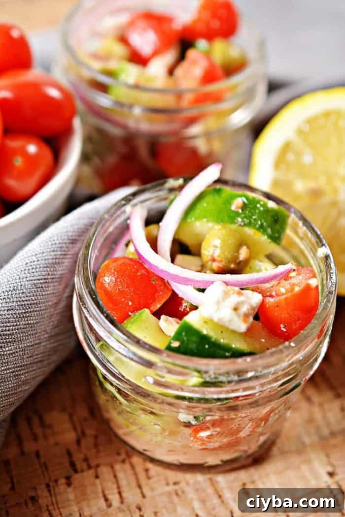 small mason jar containing keto greek salad in a jar