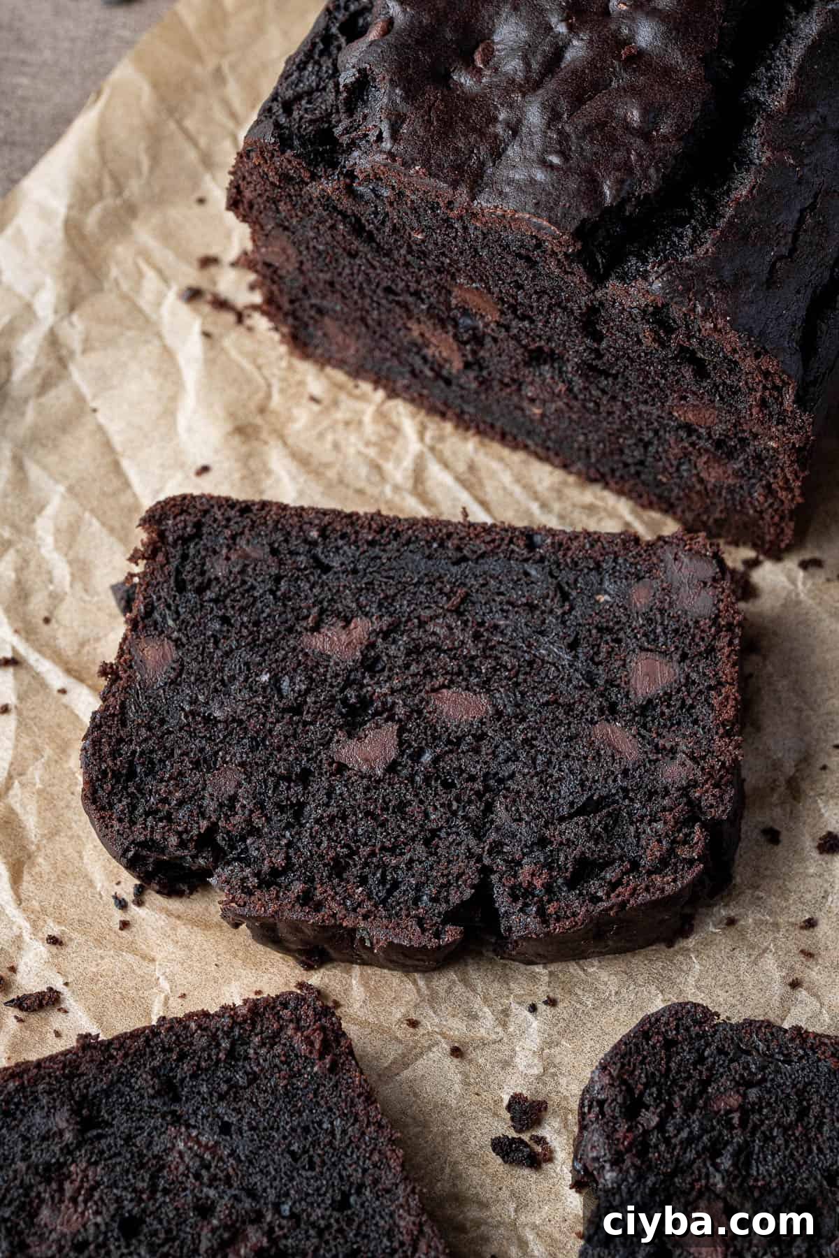 Close up of a slice  of vegan chocolate courgette cake.