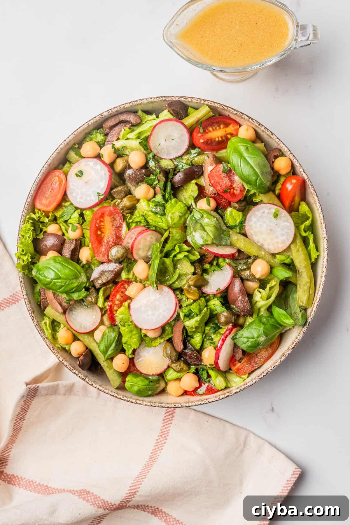 Vegan Niçoise Salad Recipe with Crispy Tofu and Olives 2 An image of vegan nicoise salad served on a big bowl.