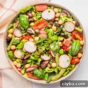 Vegan Niçoise Salad Recipe with Crispy Tofu and Olives 9 An image of vegan nicoise salad served on a big bowl.