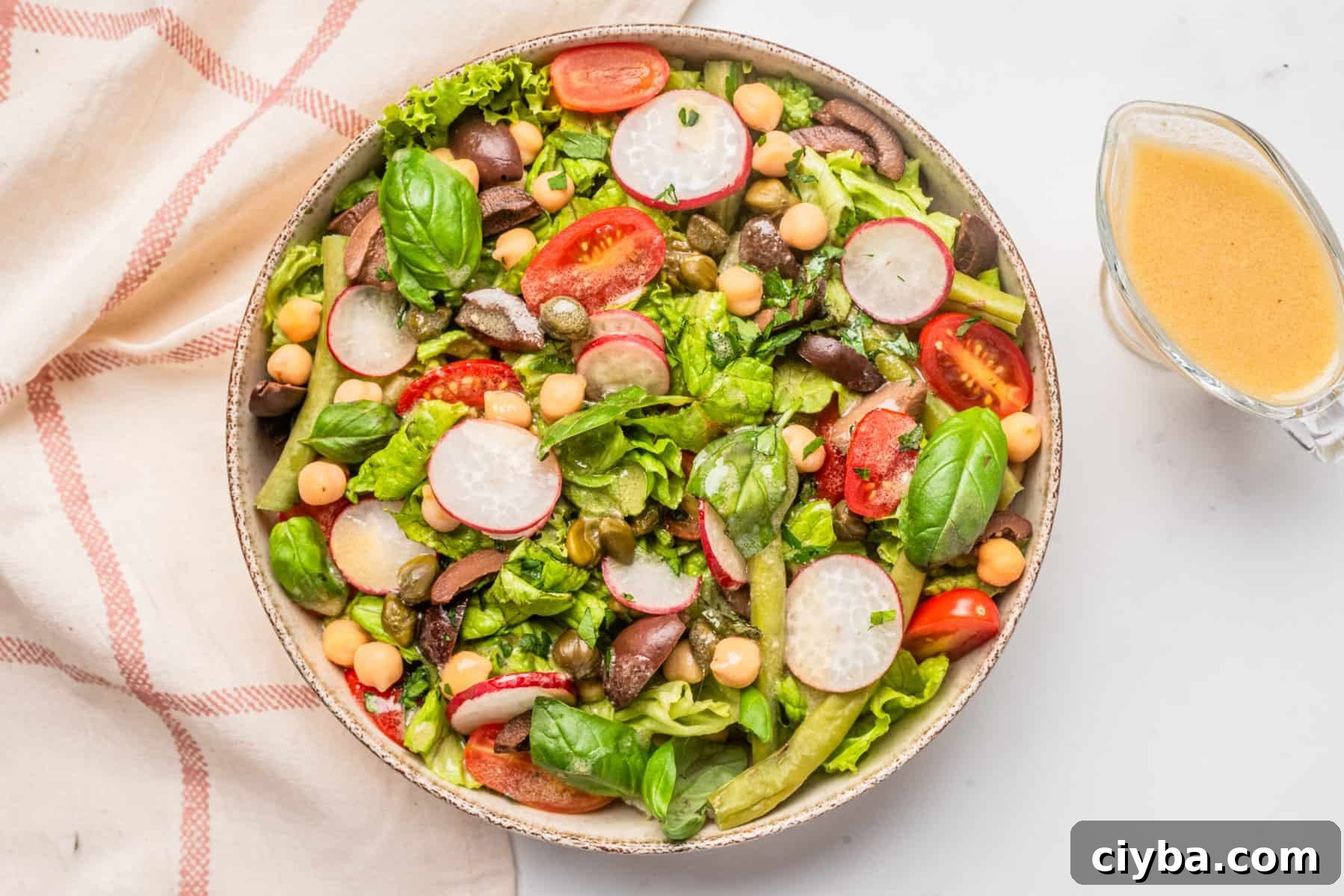 Vegan Niçoise Salad Recipe with Crispy Tofu and Olives 8 An image of vegan nicoise salad served on a big bowl.