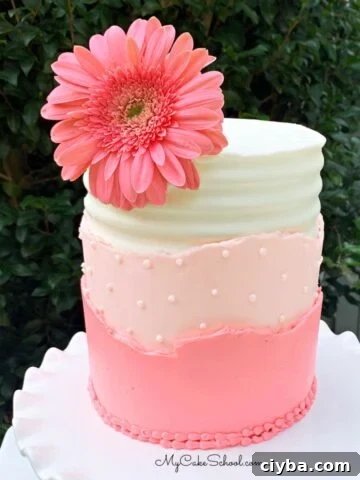 Layered buttercream cake with gerbera daisy thumbnail