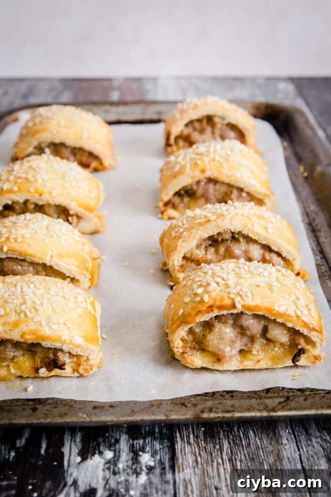 Gluten-Free Sausage Rolls with Homemade Pastry Recipe 3 sausage rolls on baking tray