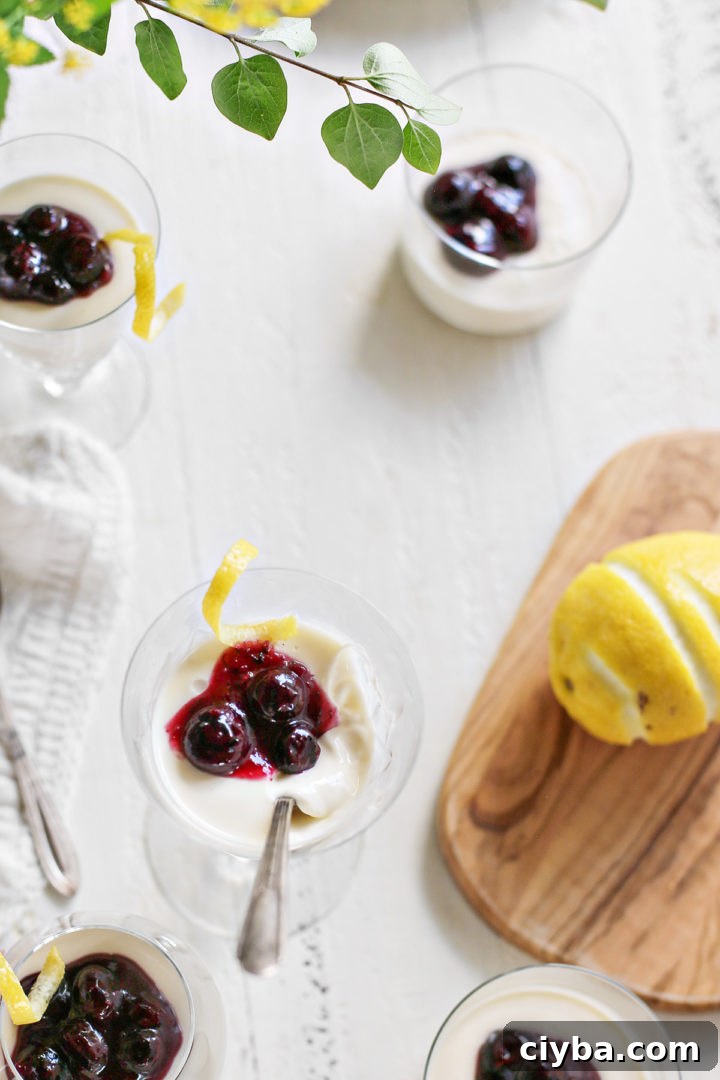 dessert dishes of lemon panna cotta on a white wooden table