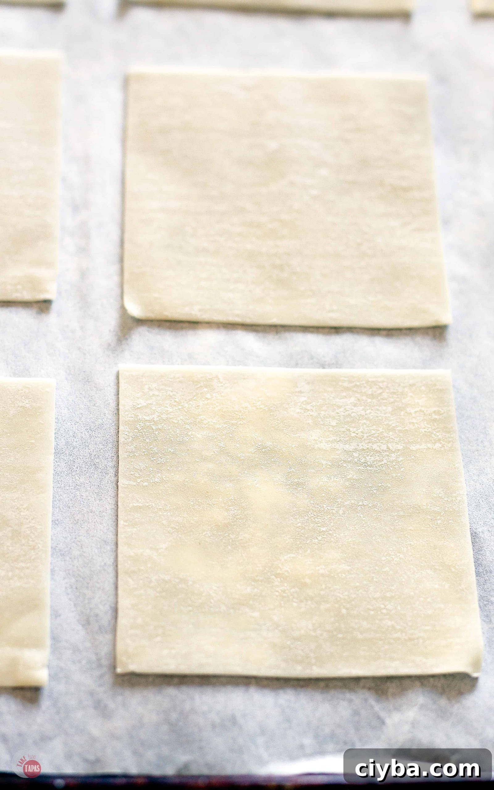 Turtle Wonton Kisses: Chocolate-Peanut Butter Candy Recipe 4 wrappers on parchment paper