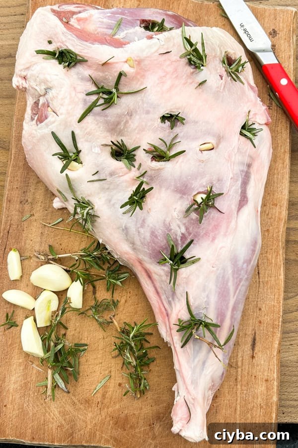 leg of lamb studded with rosemary and garlic