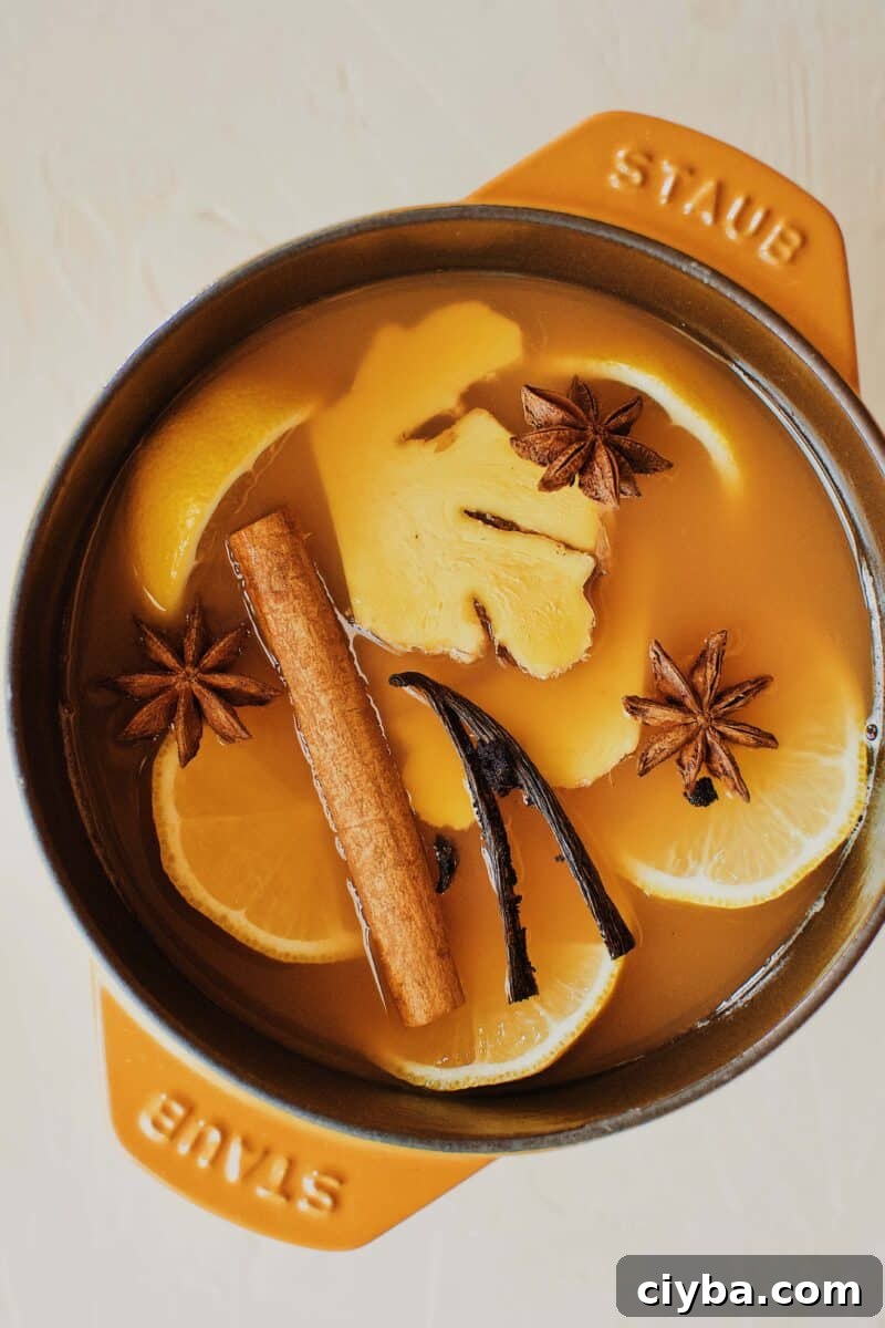 Wassail steeping in a pot.
