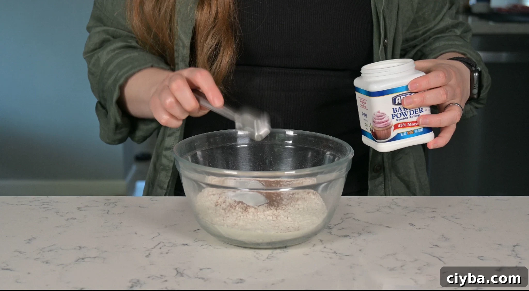 Mixing together the dry ingredients for the cake.