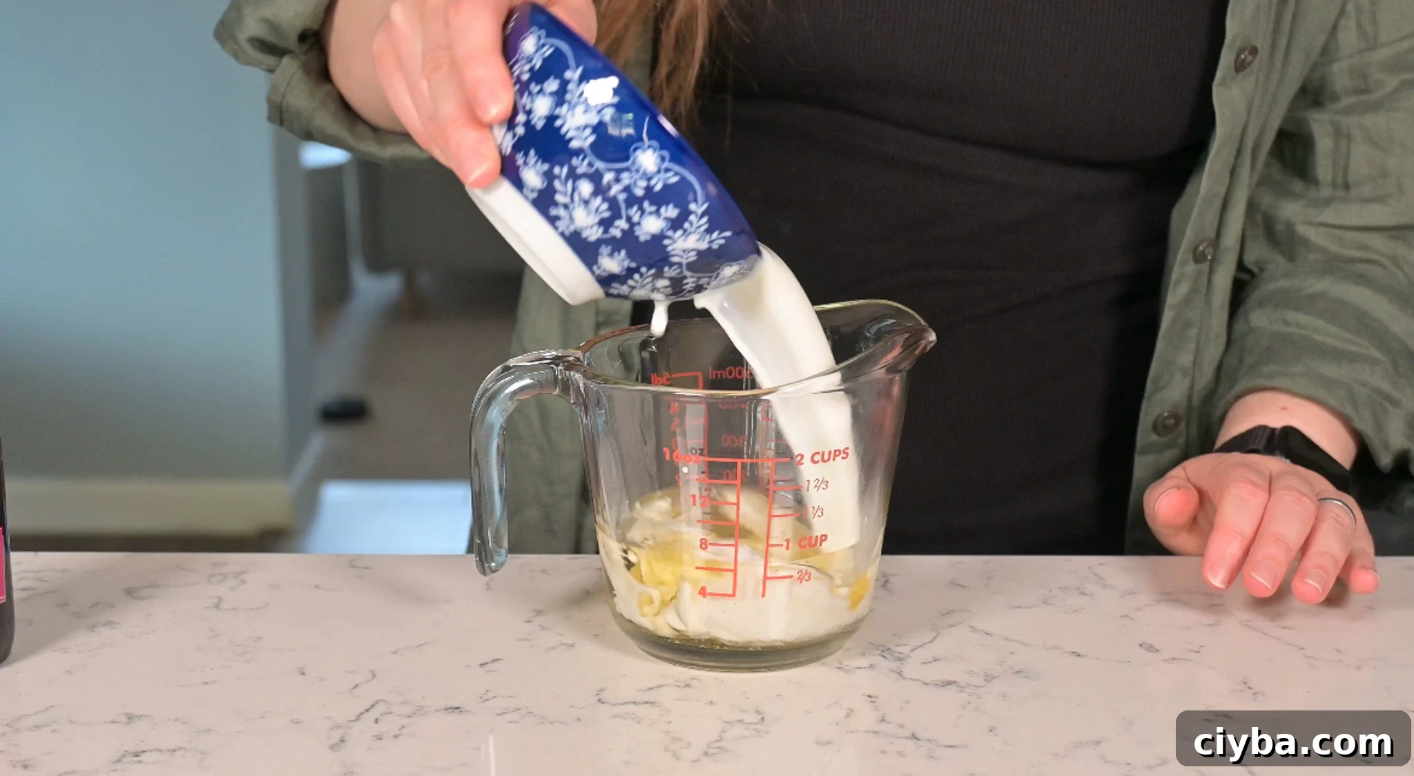 Mixing together the wet ingredients for the cake.