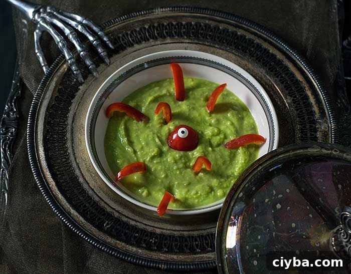 Spooky Green Vegan Potato Soup Recipe for Fall Halloween 3 Green Potato Soup with red pepper monster