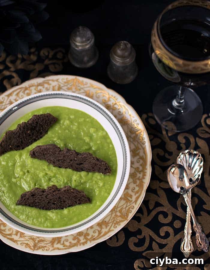 Spooky Green Vegan Potato Soup Recipe for Fall Halloween 4 Ghoulishly Green Vegan Potato Soup in a gothic dinner place setting with red wine