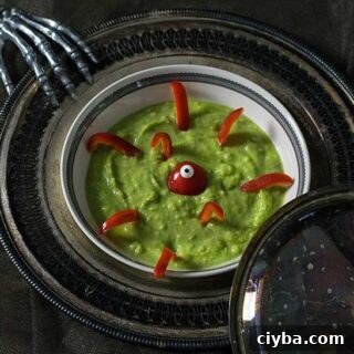 Spooky Green Vegan Potato Soup Recipe for Fall Halloween 6 Green Potato Soup with red pepper monster
