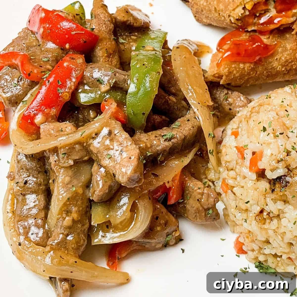 Pepper steak slices with onions and bell peppers.