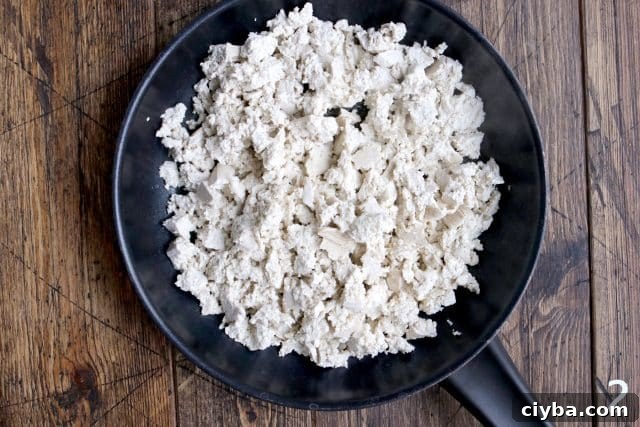Chipotle-Style Sofritas Recipe: Spicy Tofu Bowl in 30 Minutes 7 Crumbled tofu on a pan.