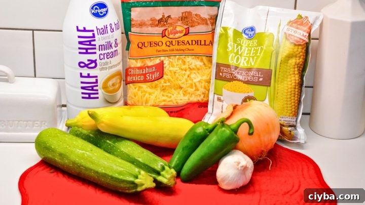 Mexican Zucchini & Yellow Squash Skillet Recipe with Fresh Salsa 3 zucchinis yellow squashes fresh or frozen corn kernels jalapeño onion garlic cloves Cream shredded cheese olive oil Salt and pepper Fresh cilantro