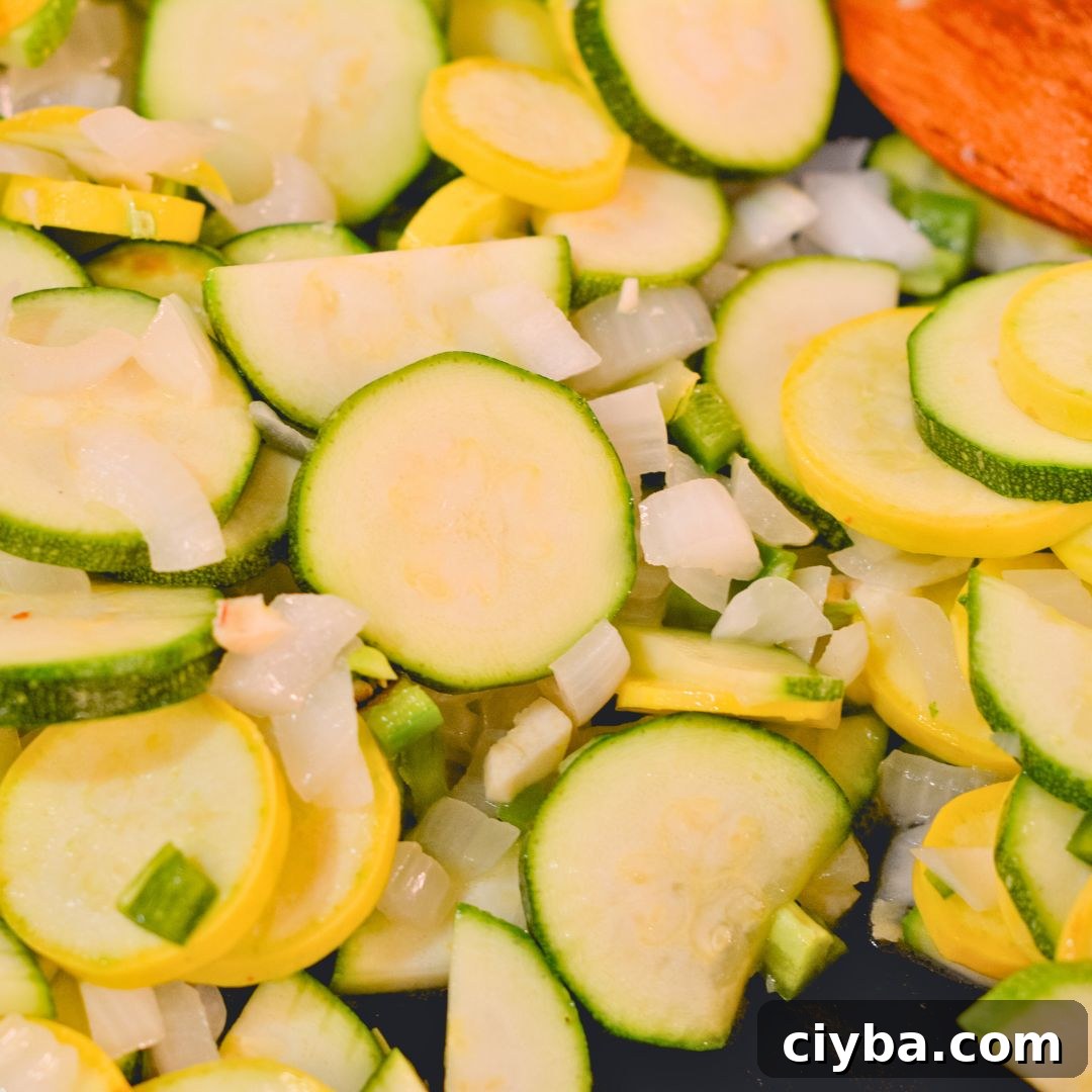 Mexican Zucchini & Yellow Squash Skillet Recipe with Fresh Salsa 4 Heat the olive oil in a large skillet over medium heat. Add the onion and garlic then sauté until fragrant, about 1 minute. Add the chopped jalapeño and cook for an additional minute. Add the sliced zucchini, yellow squash, and corn kernels to the skillet.