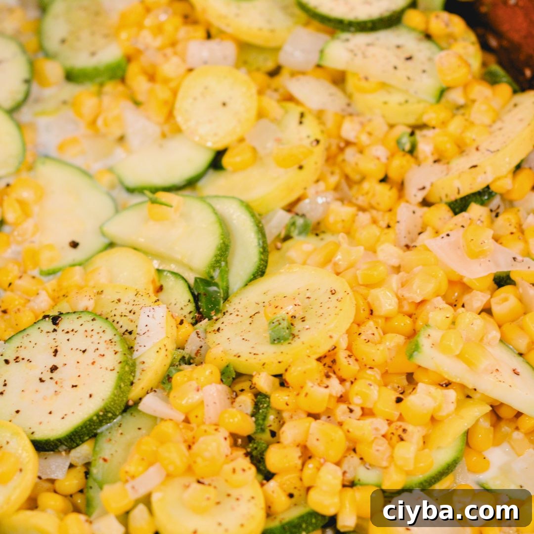 Mexican Zucchini & Yellow Squash Skillet Recipe with Fresh Salsa 6 Reduce the heat to low and pour in the cream and half the cheese.